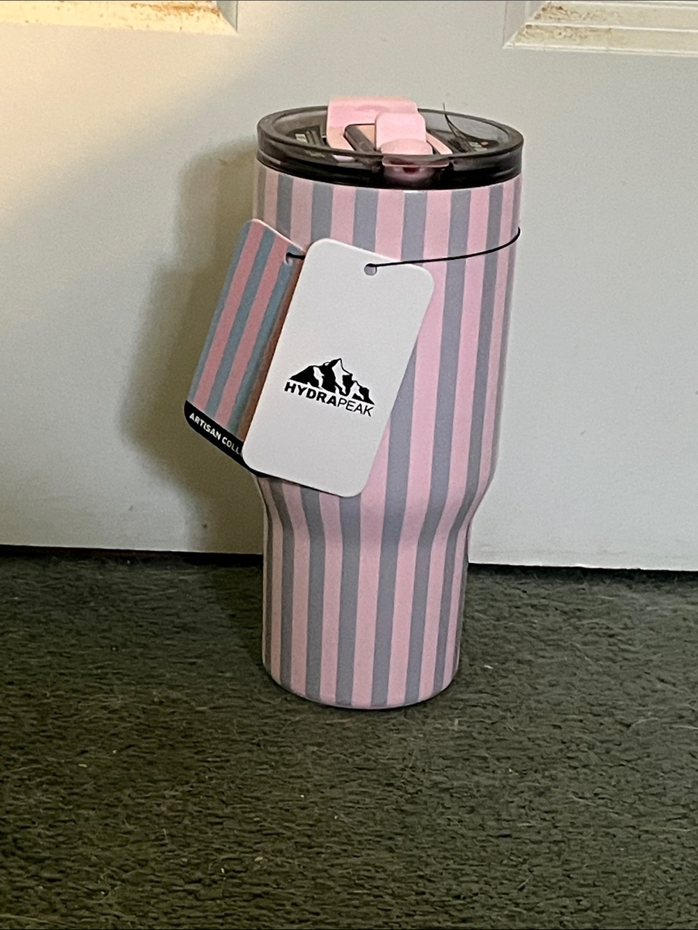A grey and pink hydrapeak water bottle